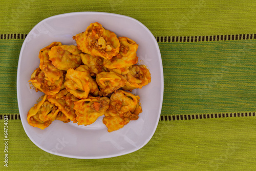 Cappellacci with ragù pasta stuffed with pumpkin photo