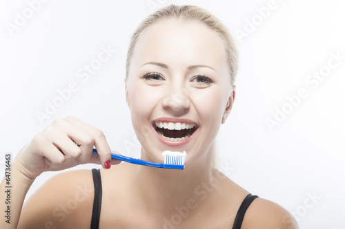 Portrait of Smiling Caucasian Woman With Toothbrush