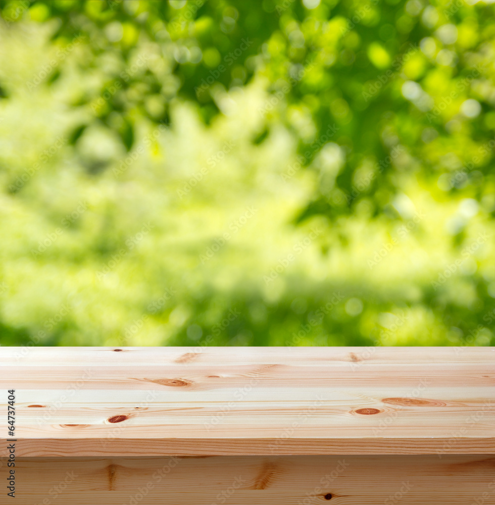 empty table against blurred garden background empty table against blurred garden background