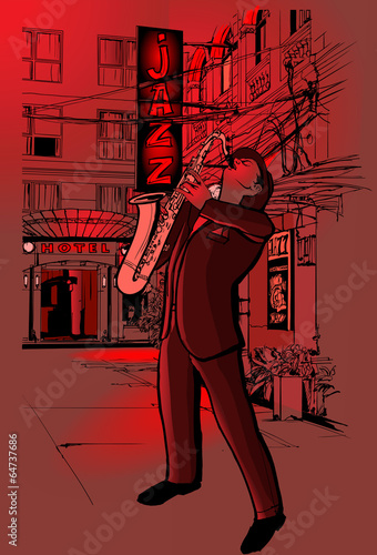 saxophone player in a street at night