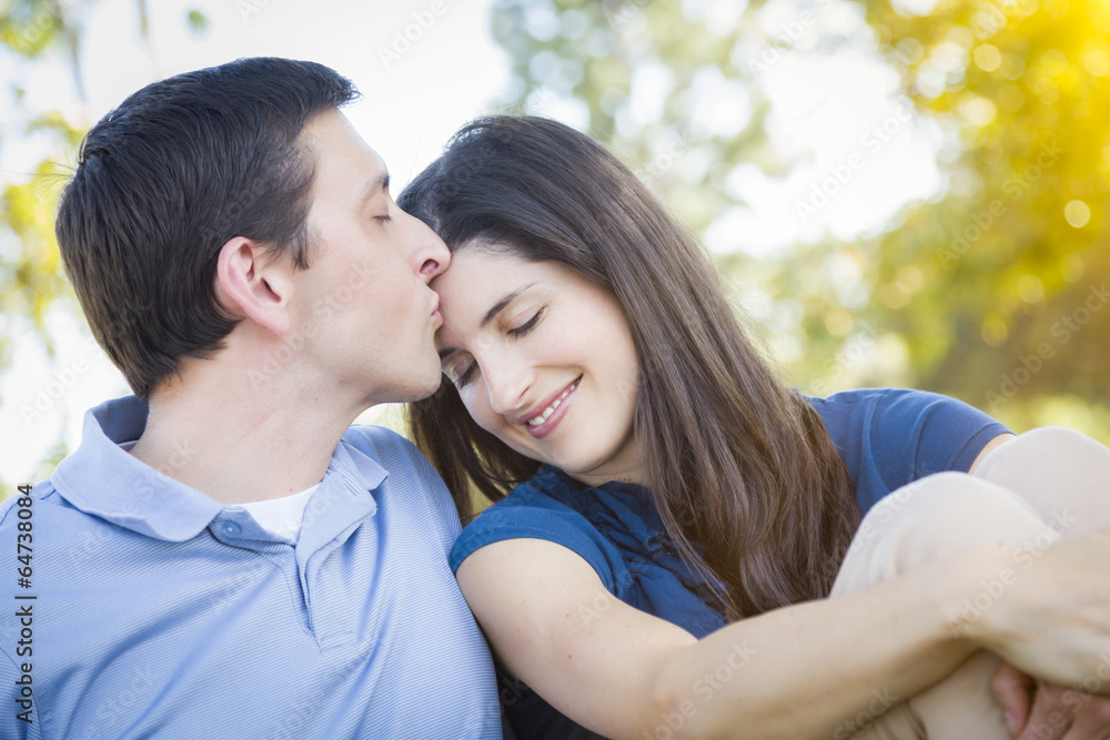 Fototapeta premium Young Attractive Couple Smooching in the Park