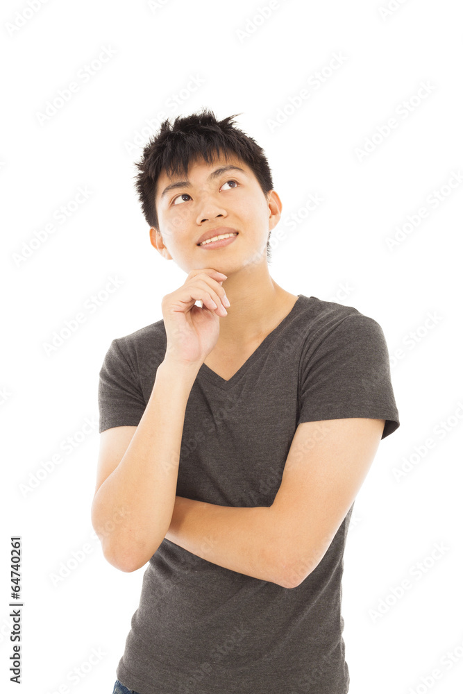 smiling young man thinking on a white background smiling young man thinking on a white background