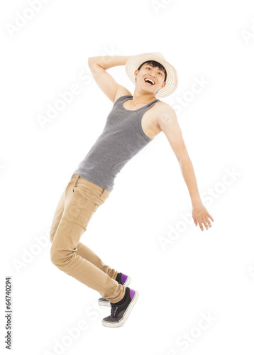young man imitate dancing pose and holding a hat