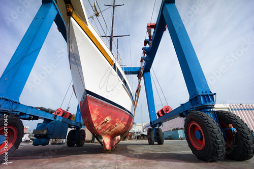 hauling out a sailing boat in boatyard