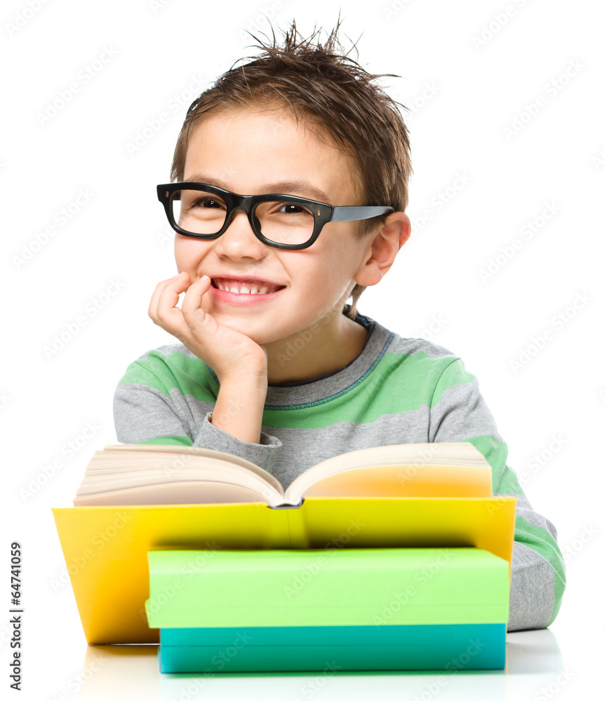 Little boy is reading a book Little boy is reading a book