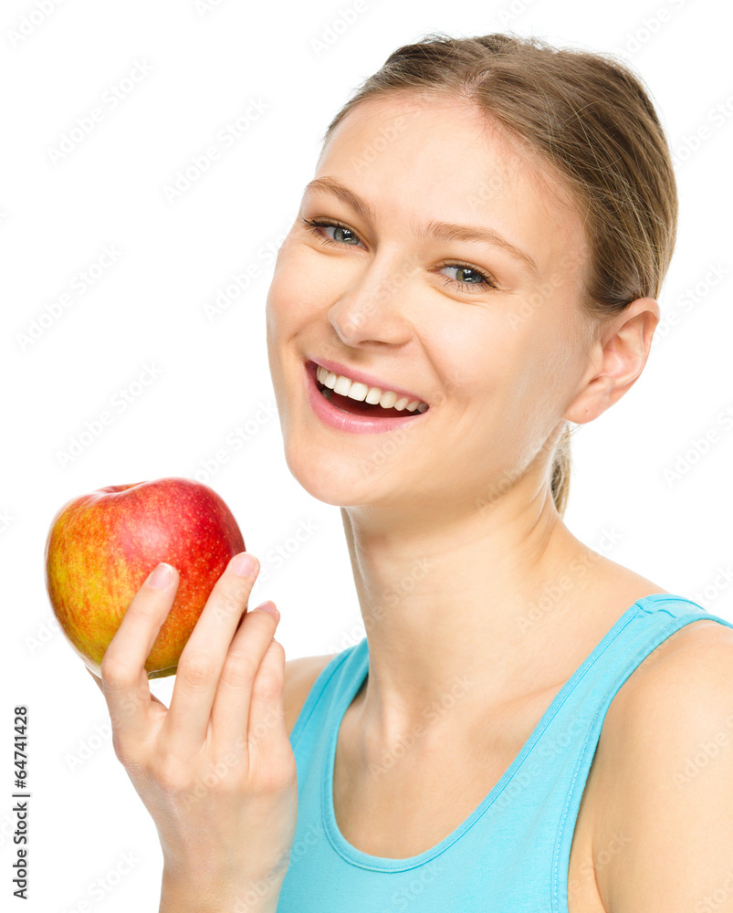 Young happy girl with apple Young happy girl with apple