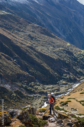 Hiker walks on train in Himalayas