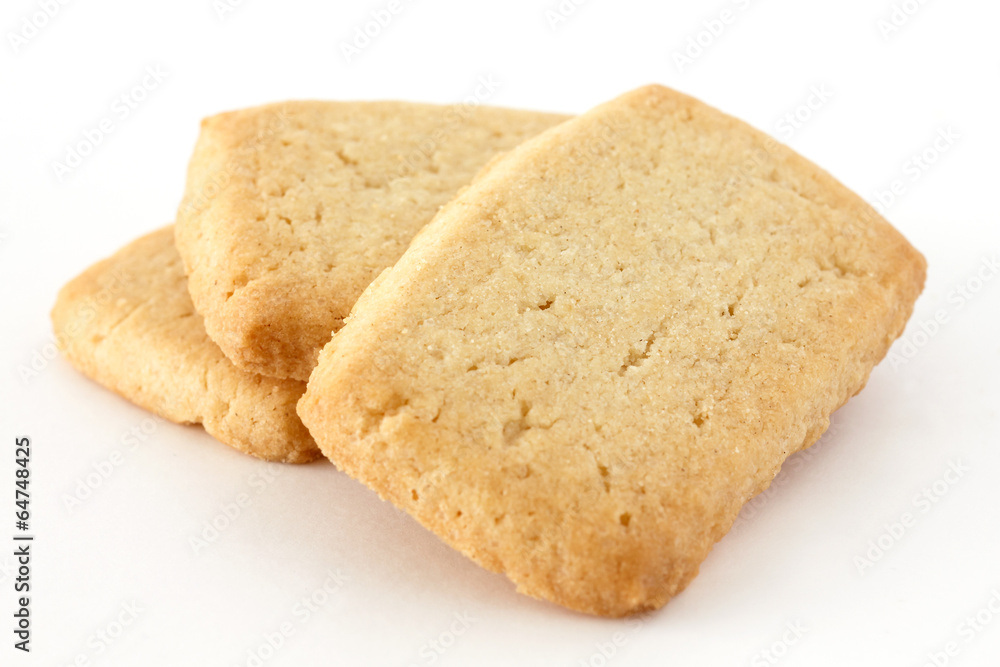 Butter biscuits in a stack on a white surface. Butter biscuits in a stack on a white surface.