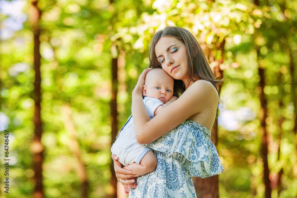 Mother with her child take rest in park Mother with her child take rest in park