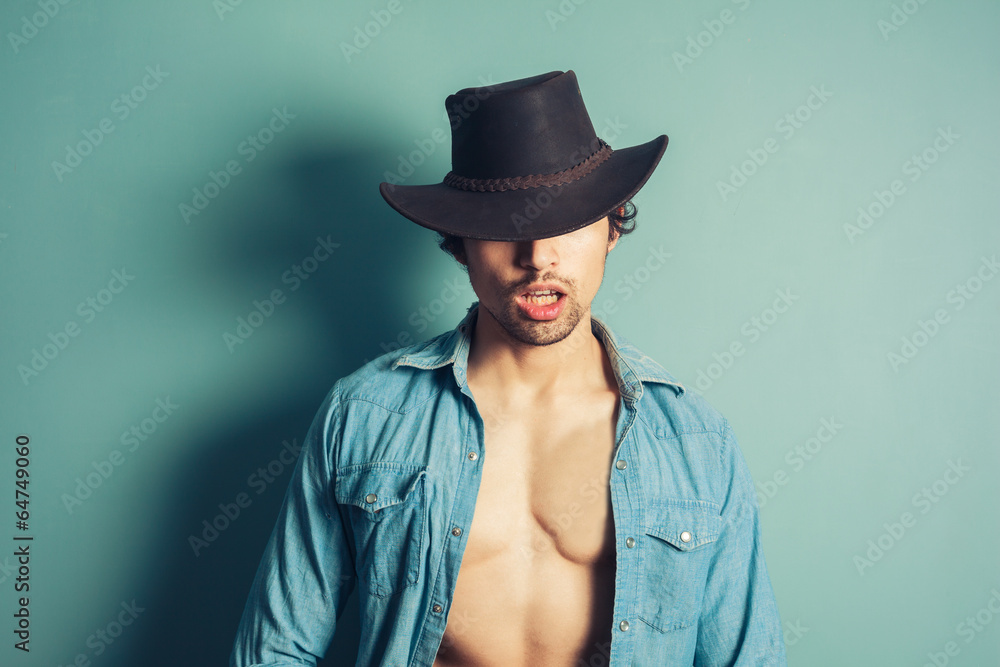 Sexy young cowboy with open shirt Sexy young cowboy with open shirt