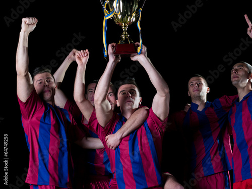 soccer players celebrating victory