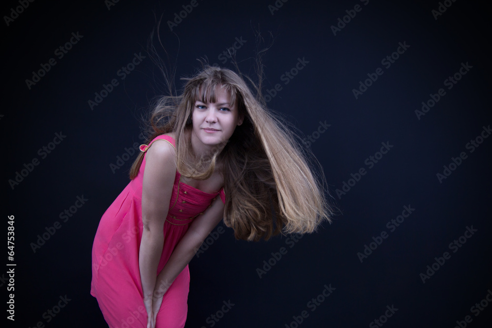 Happy girl in a pink dress