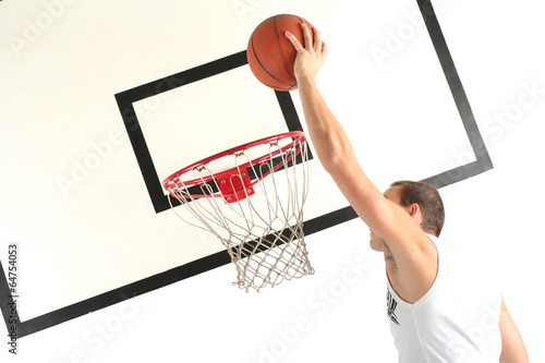 Young man playing basketball photo