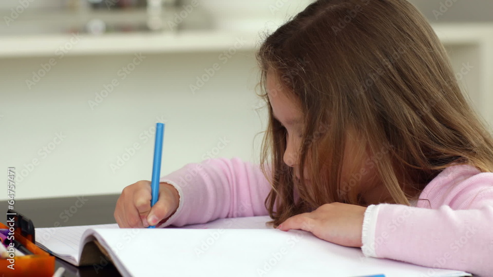 Little girl drawing at the kitchen table Little girl drawing at the kitchen table