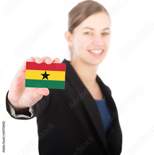 business woman holding a card with the flag of Ghana