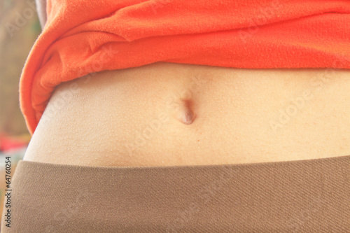 Obraz na plátně navel of the stomach of woman