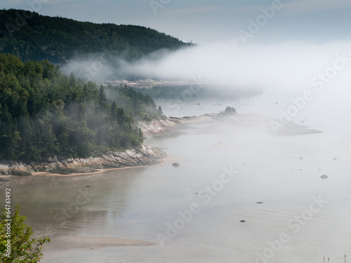 Fog over river, Quebec, Canada