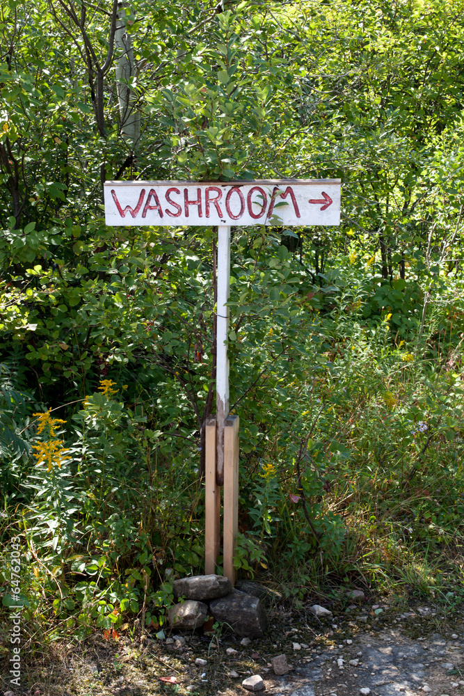 Washroom sign in a forest, Tobermory, Ontario, Canada