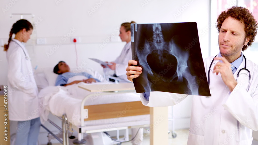 Doctor examining xray in the ward Doctor examining xray in the ward