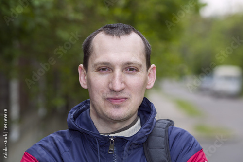 Portrait of the young man on the street
