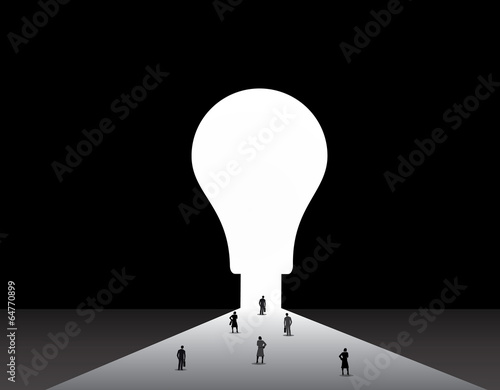 Business men and women standing front of big idea lightbulb door