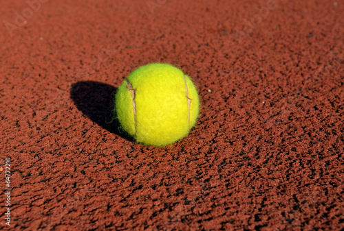 Tennis Ball on the Court Close Up at Sunset