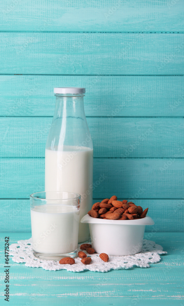 Almond milk in bottle with almonds in bowl, Almond milk in bottle with almonds in bowl,