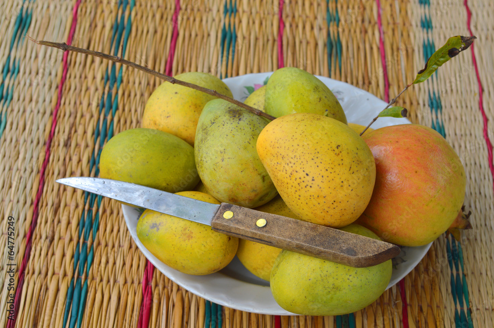 ripe local Thai mangoes and pomegranate