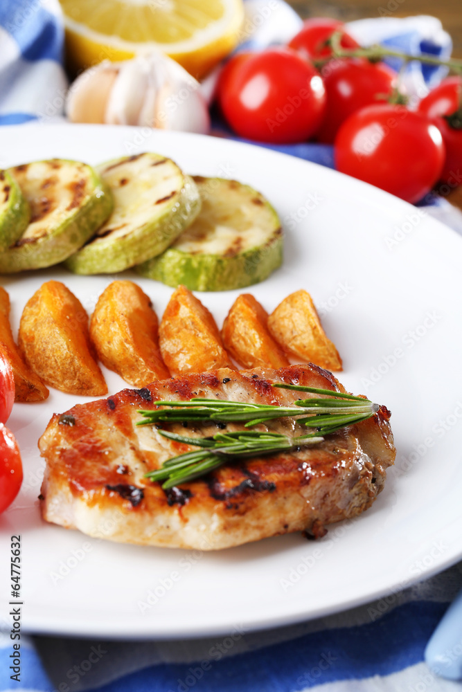 Grilled steak, grilled vegetables and fried potato pieces Grilled steak, grilled vegetables and fried potato pieces