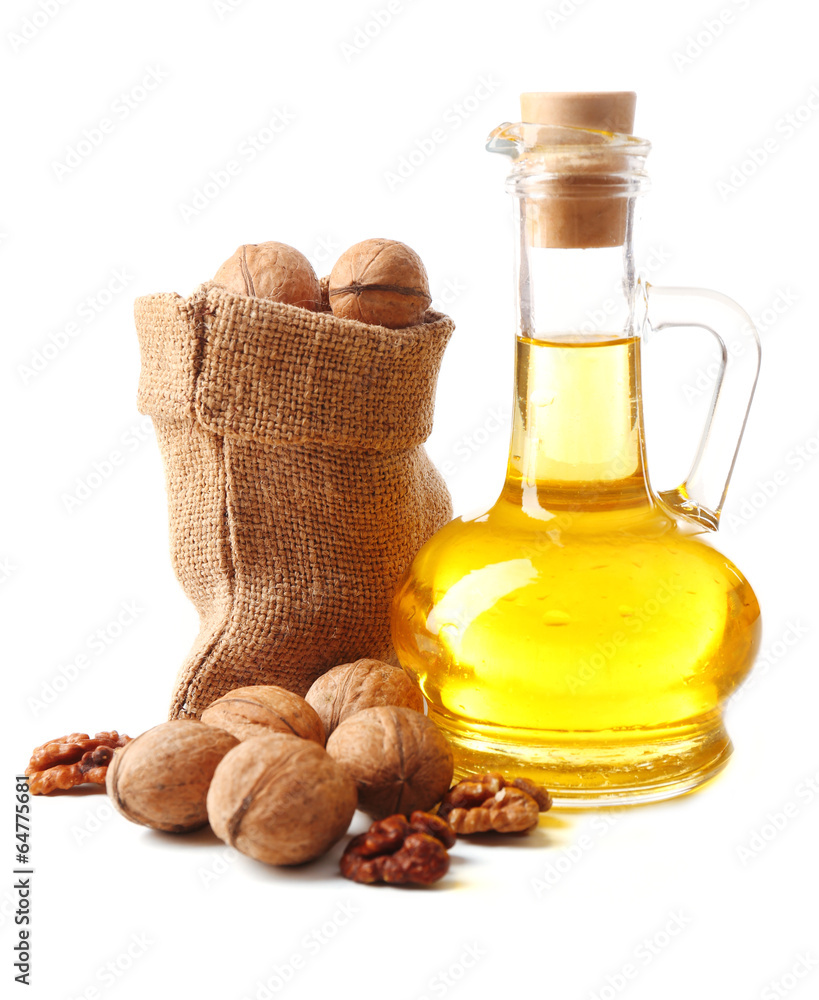 Walnut oil and nuts, isolated on white Walnut oil and nuts, isolated on white