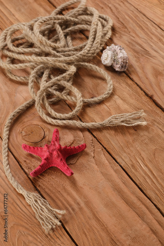 rope shells starfish on wooden boards