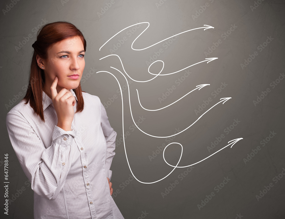 Attractive teenager looking at multiple curly arrows