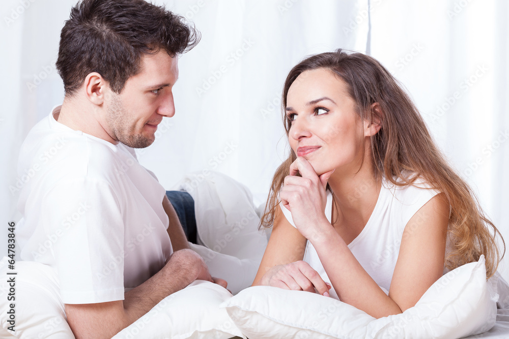 A couple contemplating in bed A couple contemplating in bed