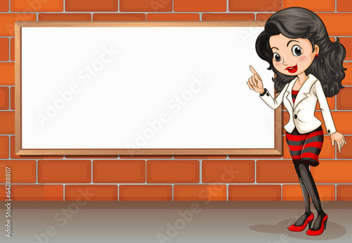 A lady standing beside the empty signboard