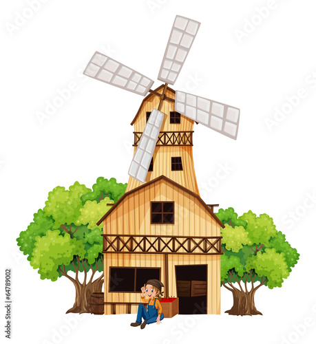 A big wooden house with a windmill