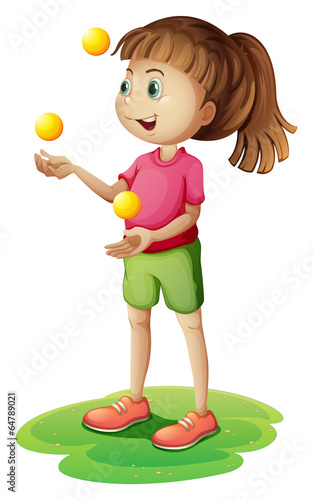 A cute little girl juggling