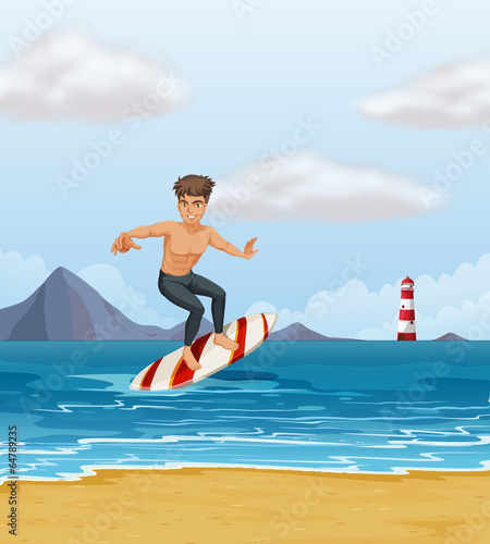 A boy surfing at the beach