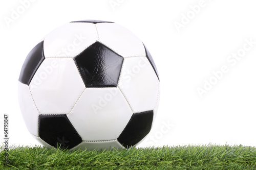 Stitch leather soccer ball on green grass.