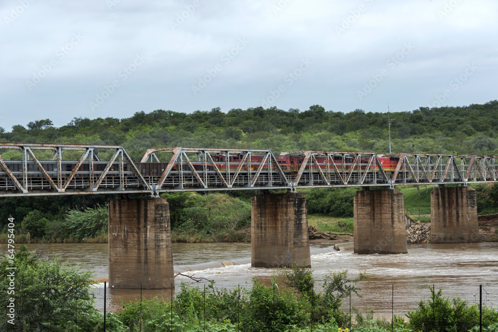 old train crossing the elephants river in south africa