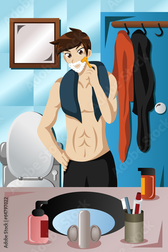 Young man shaving in the bathroom