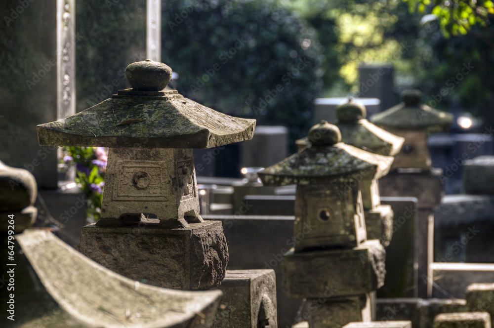 Japanese cemetery with stone lanterns