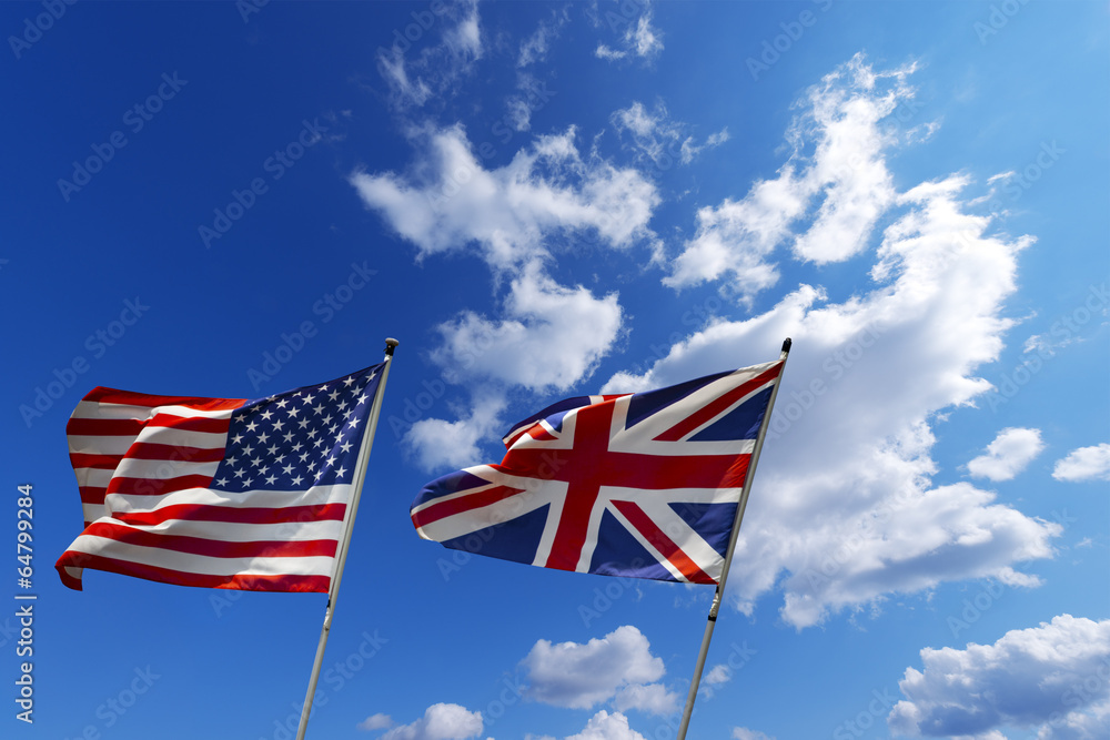 USA and UK flags in the blue sky