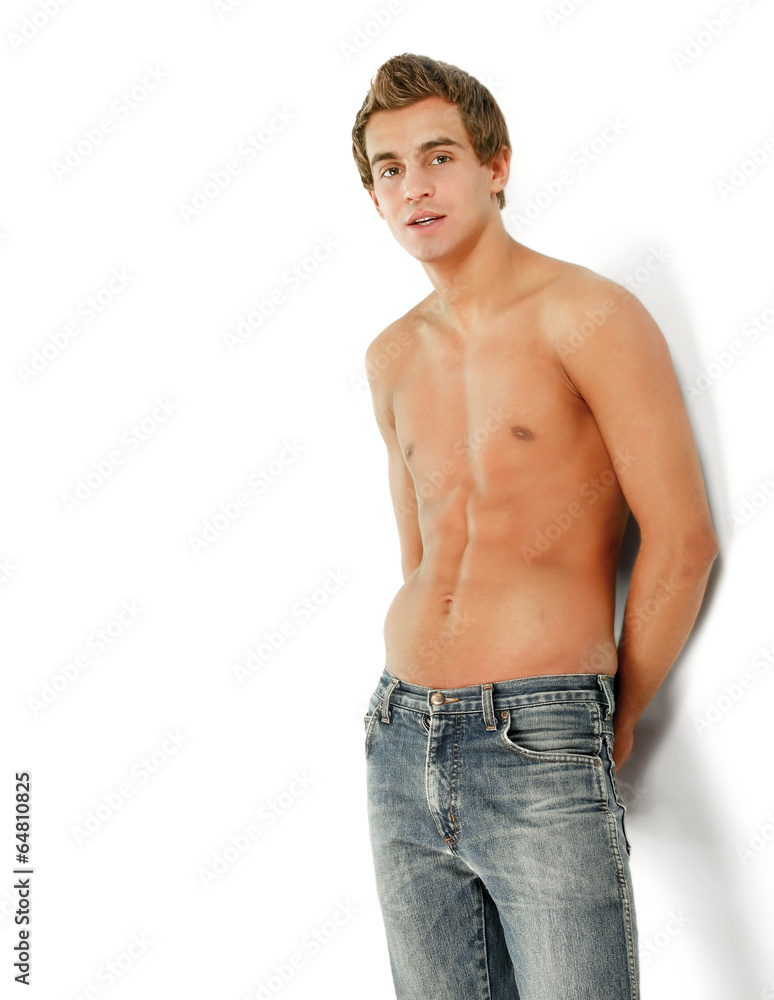 A young handsome guy holding arms in pocket A young handsome guy holding arms in pocket
