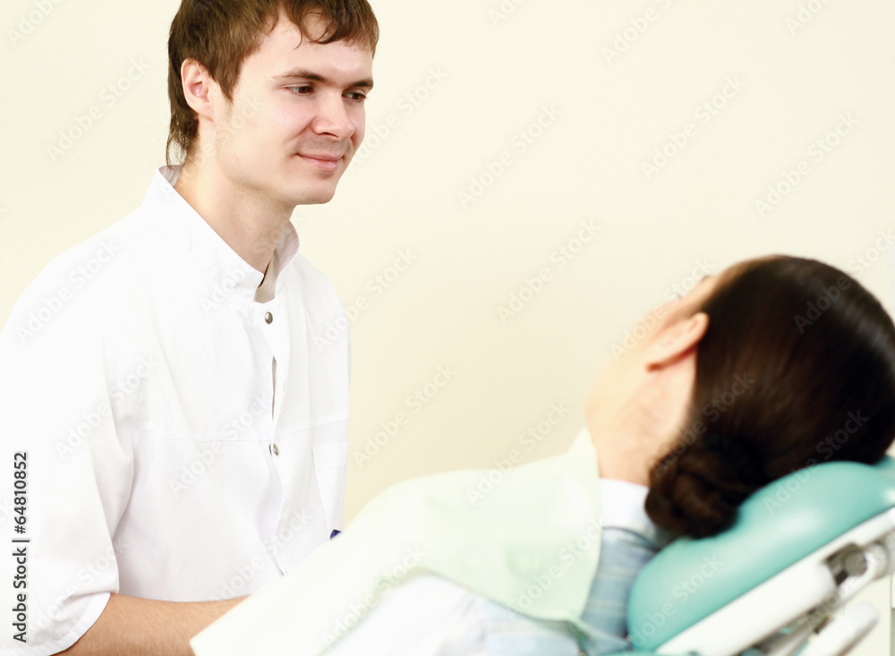 Fototapeta premium Young woman with dentist in a dental surgery.