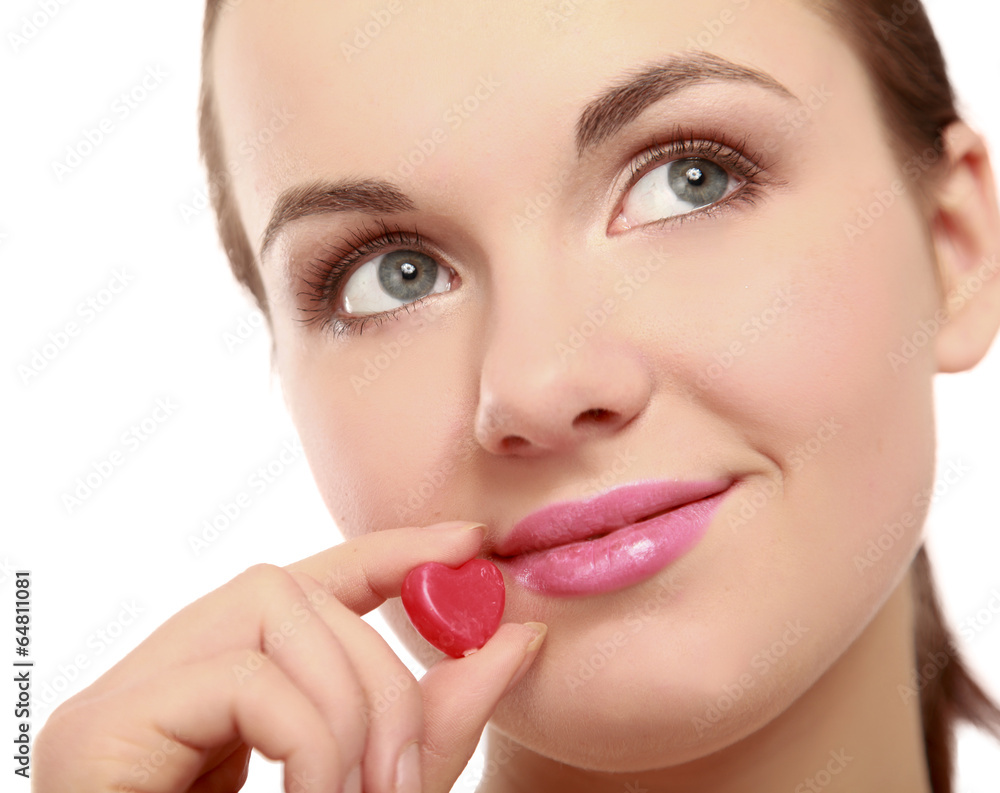 A beautiful woman is holding a symbol of a heart