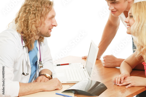 Young couple consulting with doctor isolated on white