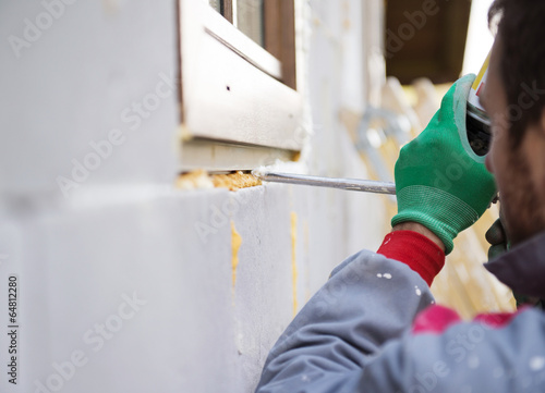 Принти на полотні Man insulating windows