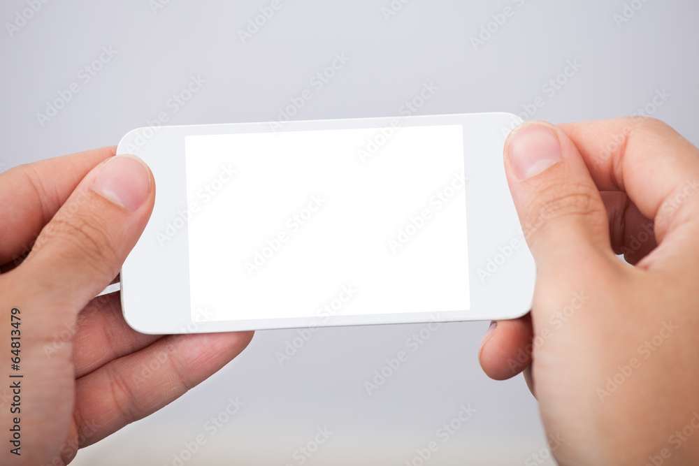 Hand Holding Smartphone With Blank Screen Hand Holding Smartphone With Blank Screen