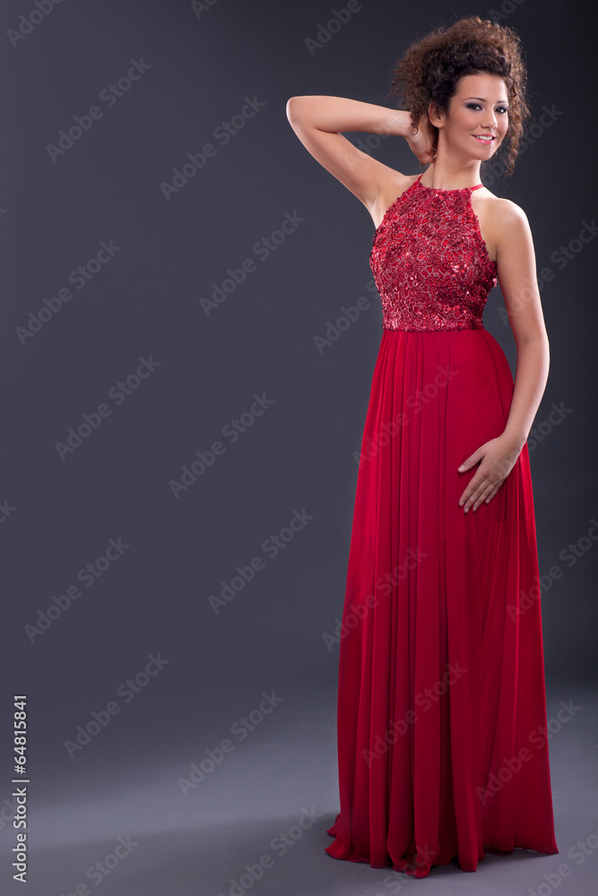 Glamorous elegant woman in a trendy red dress