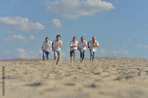 Family running barefoot